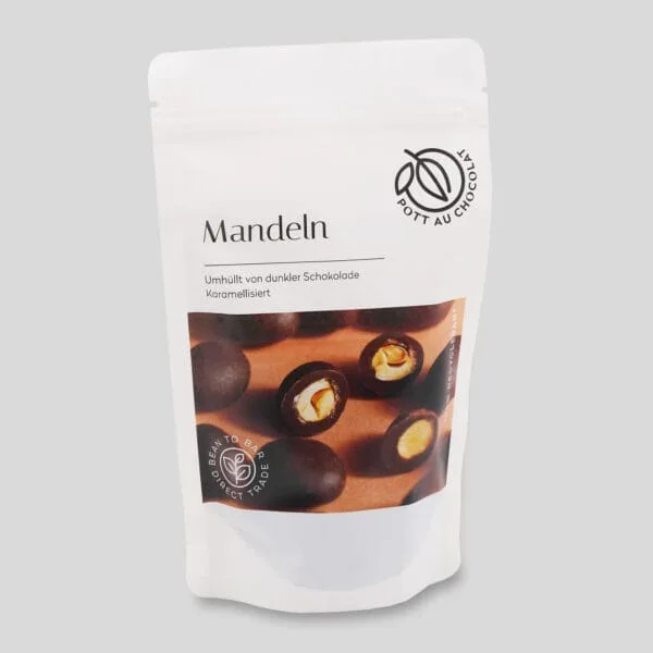Feinkost-Tüte: Karamellisierte und schokolierte Mandeln von Pott au Chocolat mit Foto von den Mandeln auf der Vorderseite der Tüte