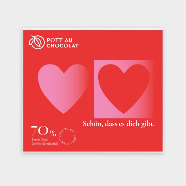 Aufschrift auf der Verpackung der Tafel 'Schön, dass es dich gibt' in weiß, mit zwei Herzen in rot und rosa auf roter Fläche. Kakaoanteil: 70% mindestens