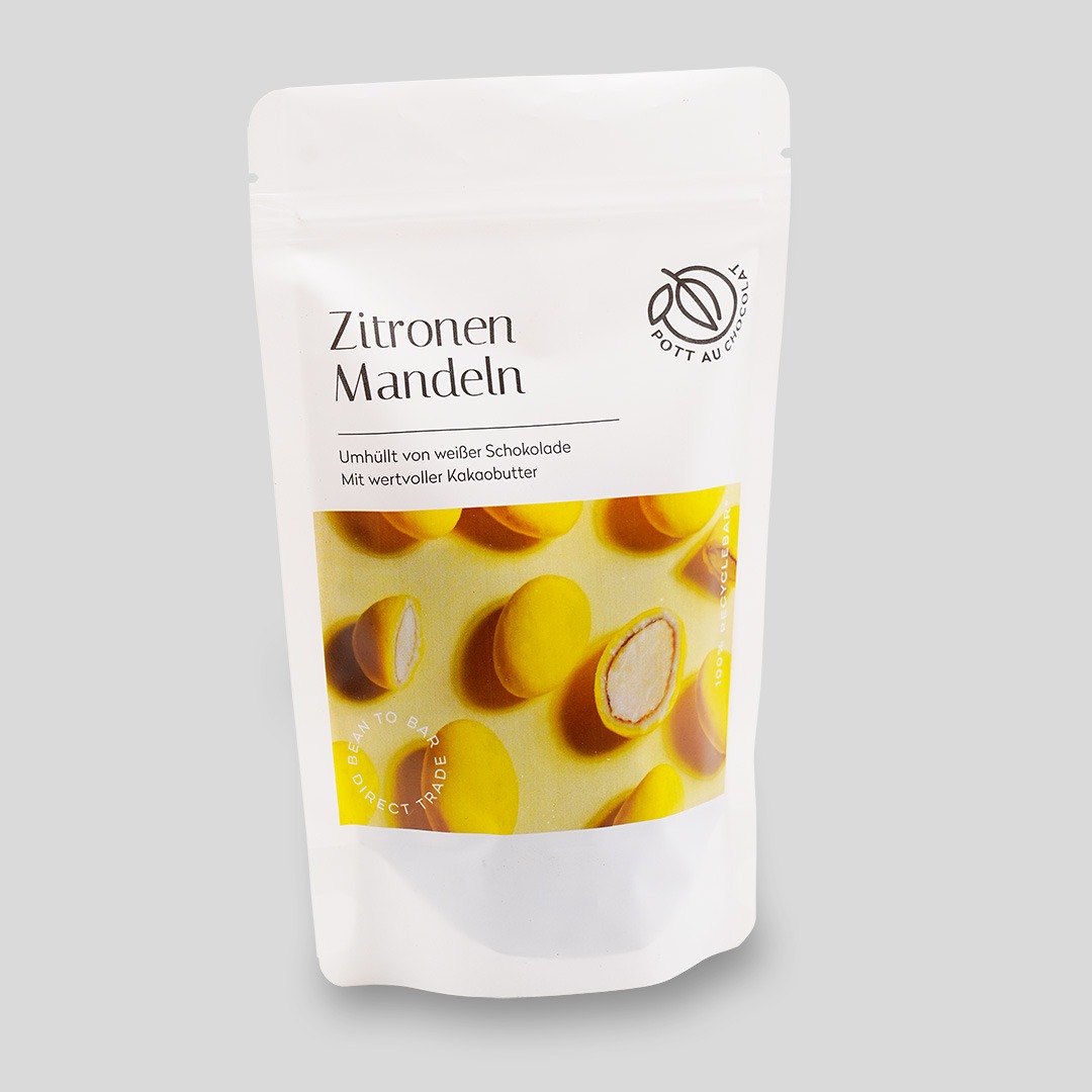 Verpackung der Zitronenmandeln. Eine weiße PET Tüte mit Aufschrift und Foto der gelben Mandeln auf gelbem Untergrund.