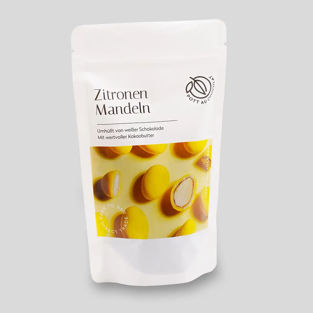 Verpackung der Zitronenmandeln. Eine weiße PET Tüte mit Aufschrift und Foto der gelben Mandeln auf gelbem Untergrund.